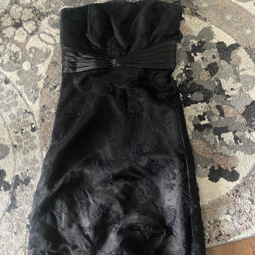 Black dress with lace overlay.